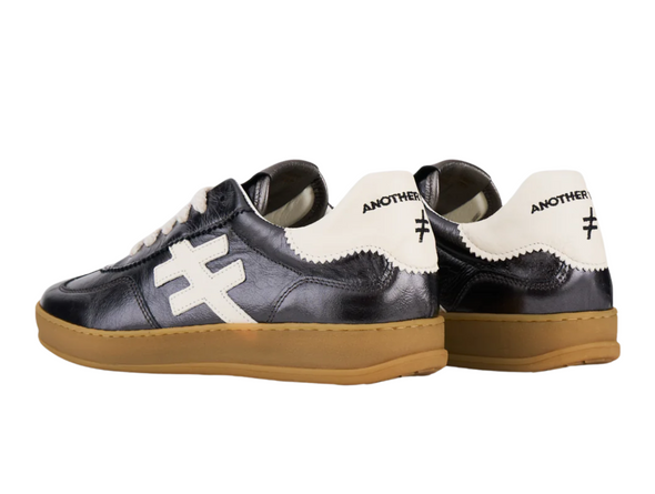 Another Trend A032-5816 black sneakers with white accents and rubber soles on white background