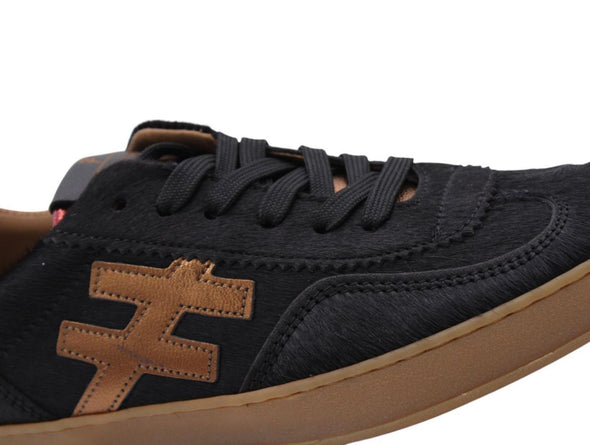 Black sneaker with a brown logo on a white background