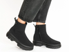 Ara 12-14102-01 Gore-Tex Black ankle boots worn with grey jeans on a white background