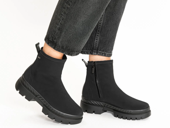 Ara 12-14102-01 Gore-Tex Black ankle boots worn with grey jeans on a white background