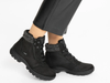 Pair of Ara 12-49309-01 Gore-Tex laced ankle boots in Black with grey trim worn by a person on a white background