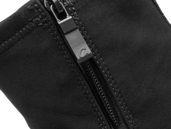 Close-up of Ara 12-14102-01 Gore-Tex Black ankle boot s zipper on a black fabric background