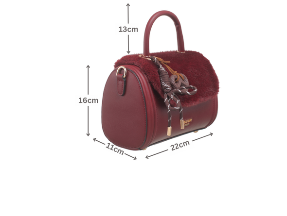 Bessie London Plush Barrel handbag in burgundy with dimensions marked on a white background