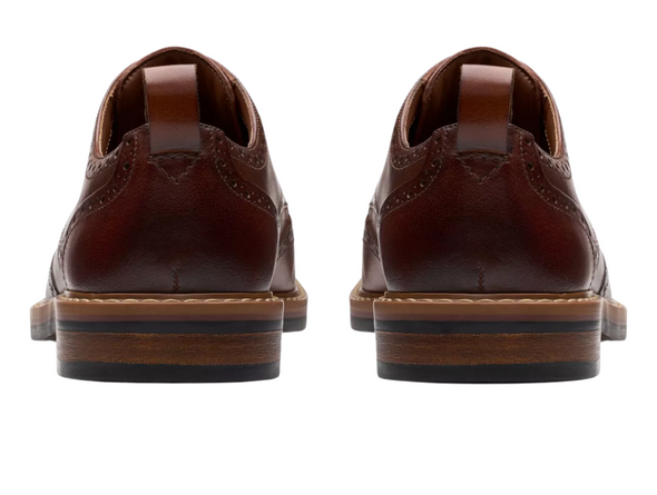 Clarks Aldwin Limit - pair of Mid Tan laced leather brogue shoes on a white background.