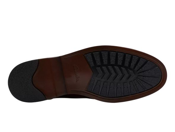Clarks Aldwin Limit - Mid Tan laced leather brogue shoe on a white background sole view