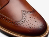 Clarks Aldwin Limit - close up of Mid Tan laced leather brogue shoe on a white background.