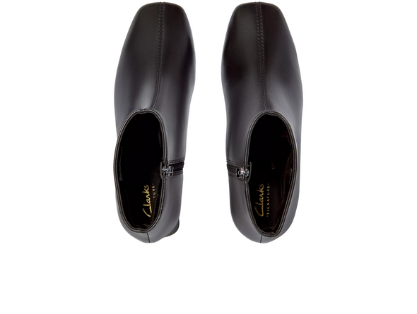 Clarks Fernie Zip - Black leather ankle boot with block heel on a white background top view
