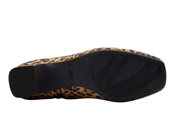 Clarks Fernie Zip - Leopard Suede ankle boot with block heel on a white background sole view