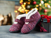 Easy B Duck - pair of Burgundy Multi bootie slipper with a strap, fluffy lining and a black sole with a blurred Christmas background. 