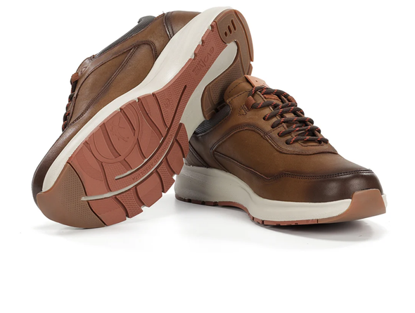 Fluchos Triton F2069 pair of laced Brown leather sneakers with white soles on a white background