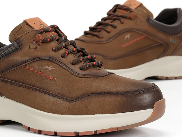 Fluchos Triton F2069 pair of laced Brown leather shoes with white soles on a light background