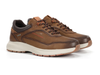 Fluchos Triton F2069 pair of laced Brown leather sneakers with white soles on a white background