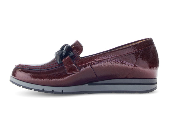 Gabor 72.415.88 Bea - Burgundy loafer with decorative buckle in patent with subtle wedge heel on white background. 