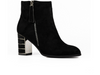 Lunar Switch GLR105 - Black zipped ankle boot with metallic accents on a medium block heel against a white background