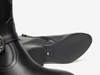 Close-up of NeroGiardini I513900D 100 - Black western inspired ankle boots with a  brand logo on a white background