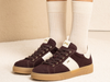 NeroGiardini I514151D 613 - laced Burgundy sneaker with white accents worn with white socks on a neutral background