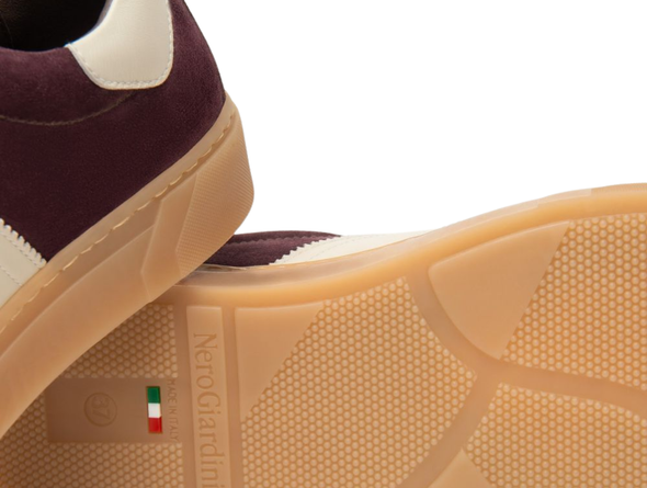 Close-up of NeroGiardini I514151D 613 - laced Burgundy sneaker with a brand logo on the sole