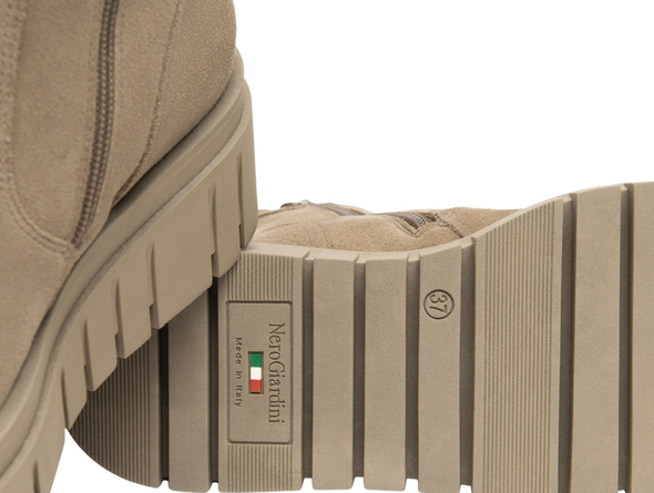 Close-up of NeroGiardini I514914D-501 - Taupe ankle boot with a sip close and a tonal platform sole on a white background