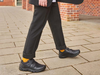 Startrite Rhino Warrior-8237-7 - Black school shoe worn by boy on pavement 