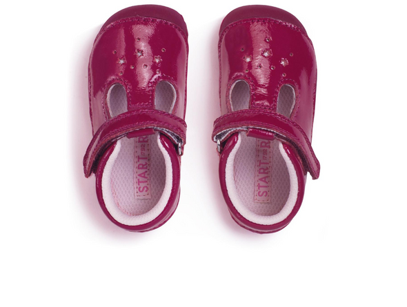 Startrite Tumble 0761-8 - Cherry Red baby shoe in red patent leather with a Velcro strap and star cut out detail on a white background top view